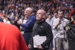 Getting ready to find his seat on the road at a men’s basketball game.